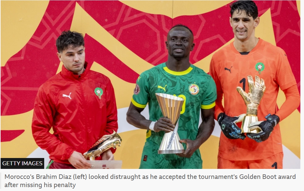 BBC/Getty Images Morocco’s Brahim Díaz (left) looks distraught as he accepts the tournament’s Golden Boot award after missing his penalty