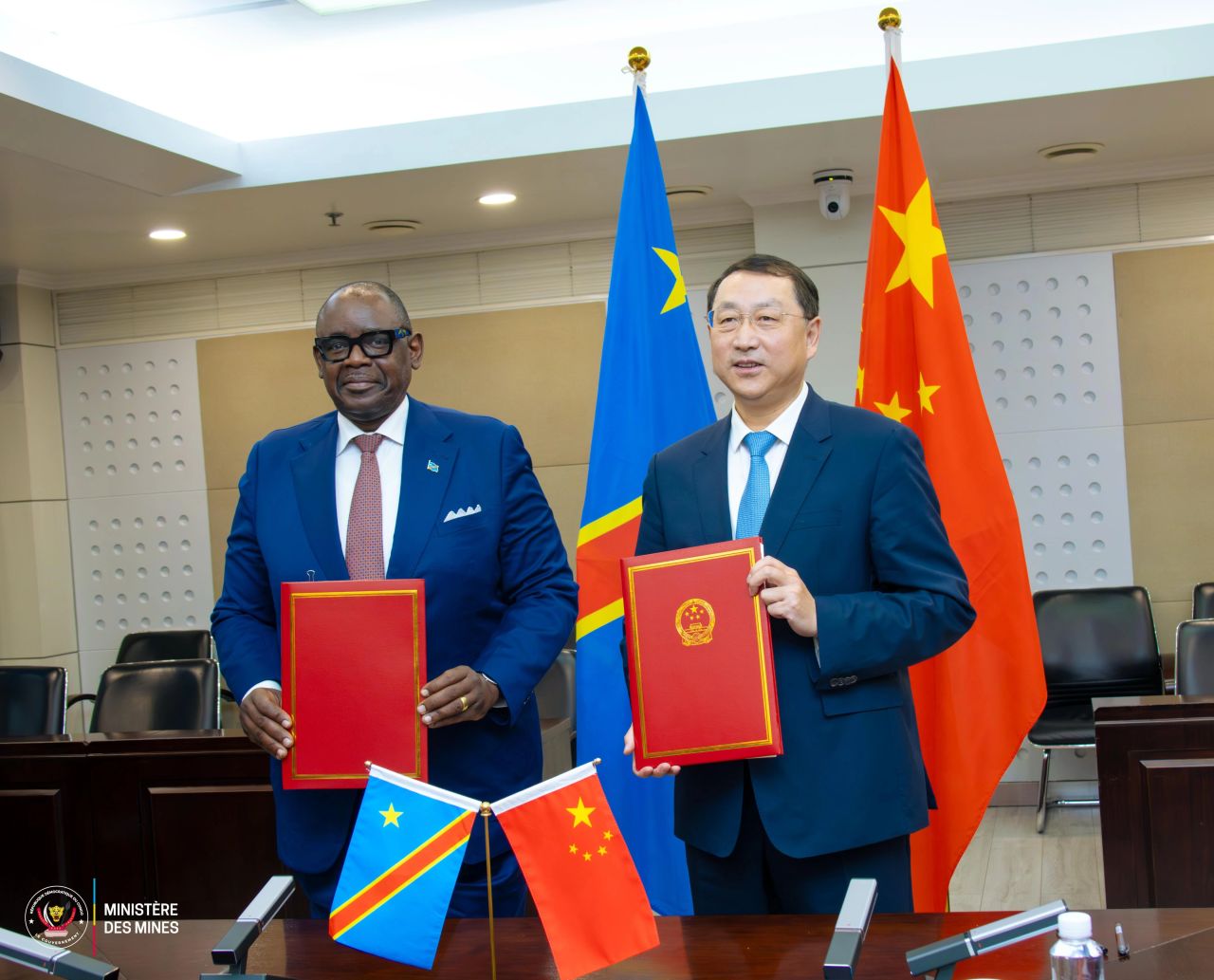 March 26th in Beijing-DR Congo's Minister Louis Watum and China's Minister of Natural Resources, Guan Zhi’ou, signing MoU.